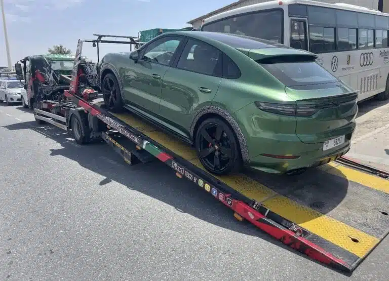 Porsche Cayenne being loaded onto a recovery truck in Dubai by TRT Recovery