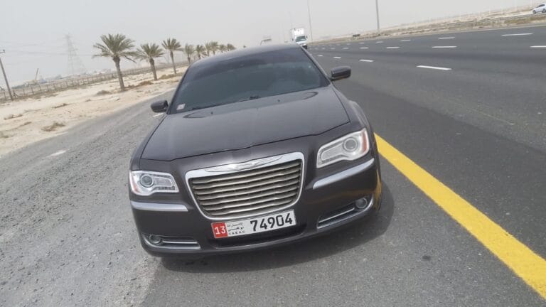 Car stopped on roadside due to empty fuel tank. Emergency fuel delivery service in Dubai by TRT Recovery