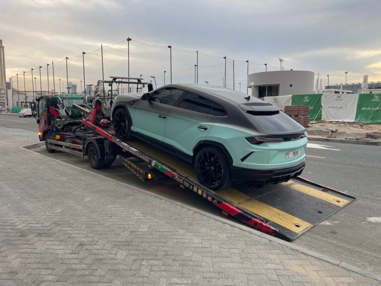 TRT Recovery near me Dubai, flatbed tow truck dispatched to a stranded driver in JVC