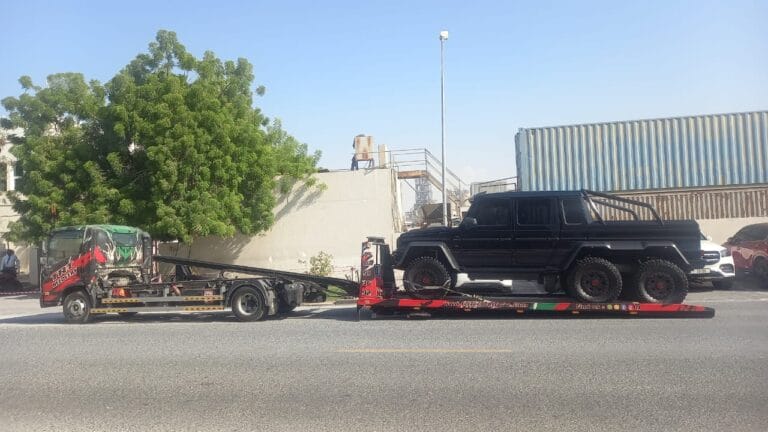 Recovery near me Dubai, TRT Recovery technician arriving at a broken down vehicle on Umm Suqeim street